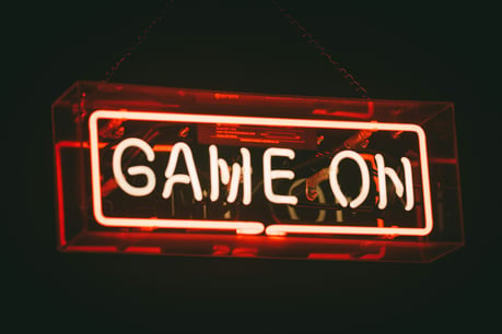 The words "Game On" in a neon sign